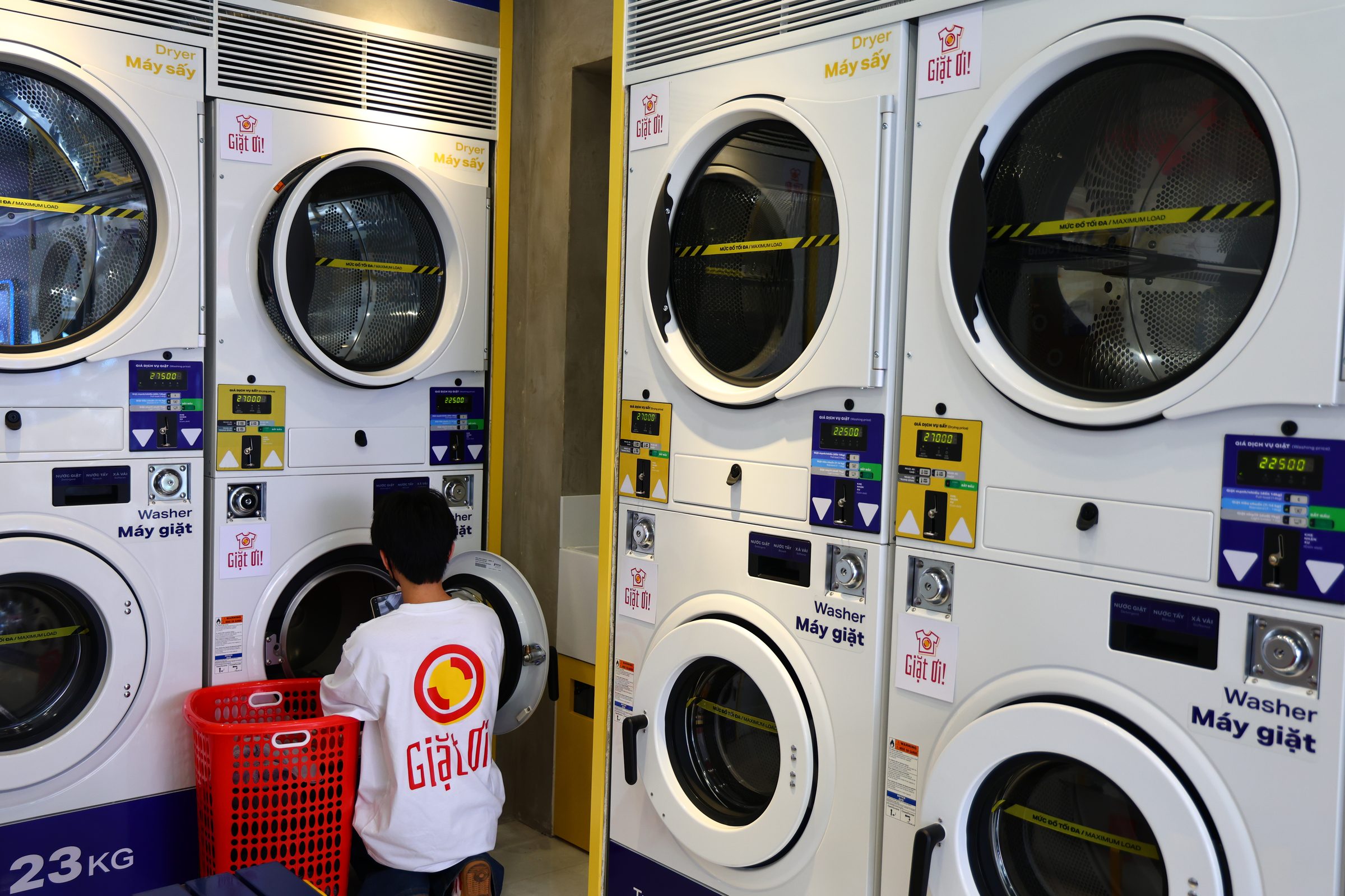 Staff kneeling loading washer.jpg?v=2026 10 19 1
